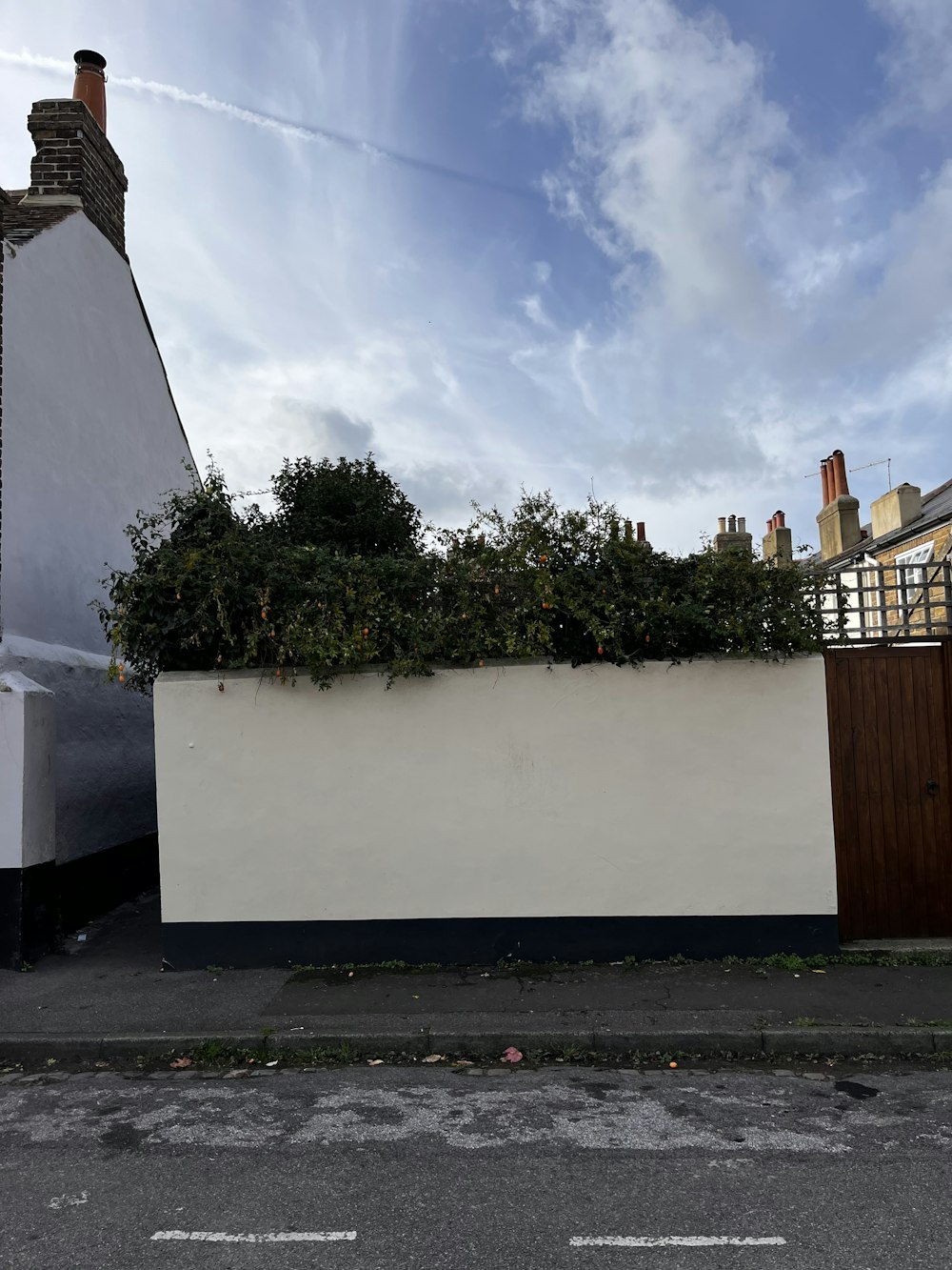 a white wall with a rainbow in the background