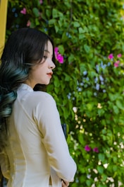 a person looking at a flower