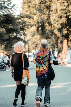 two people walking on a street
