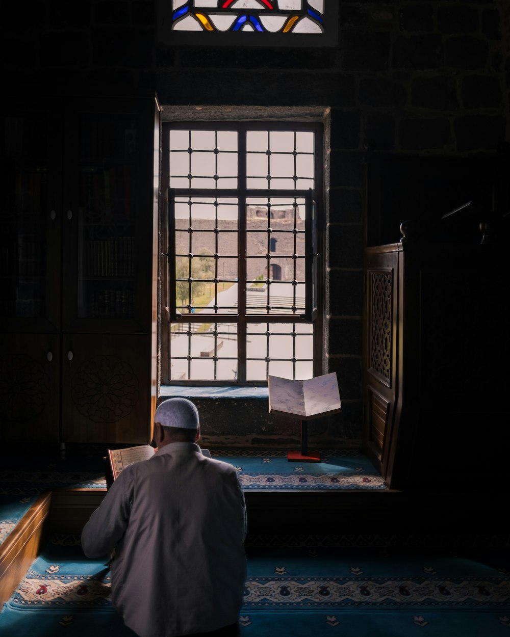 a person sitting in a doorway