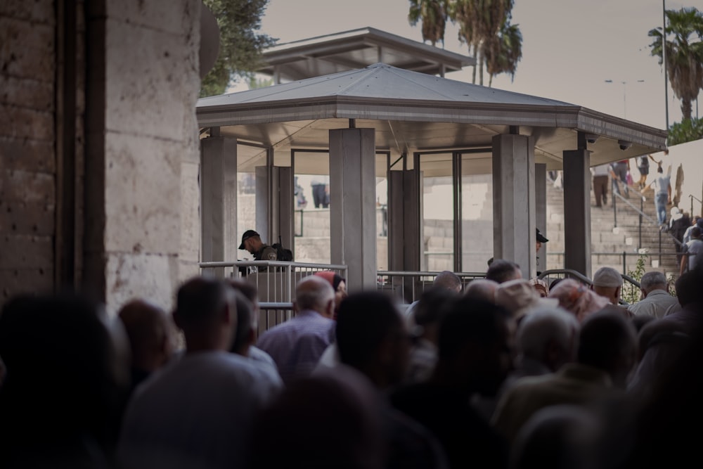 a person standing in front of a crowd of people