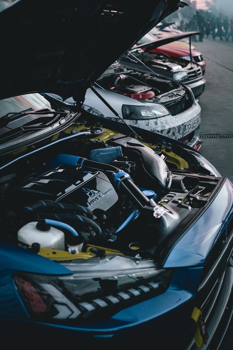 Vehicle with open hood under repair
