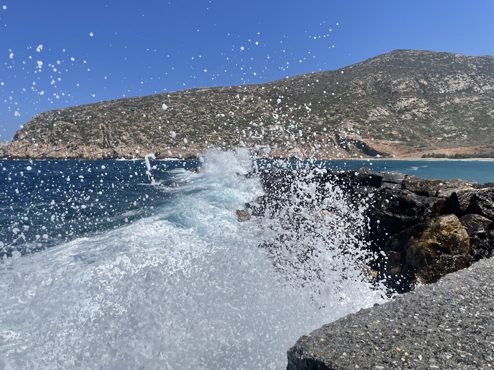 a wave crashing on rocks