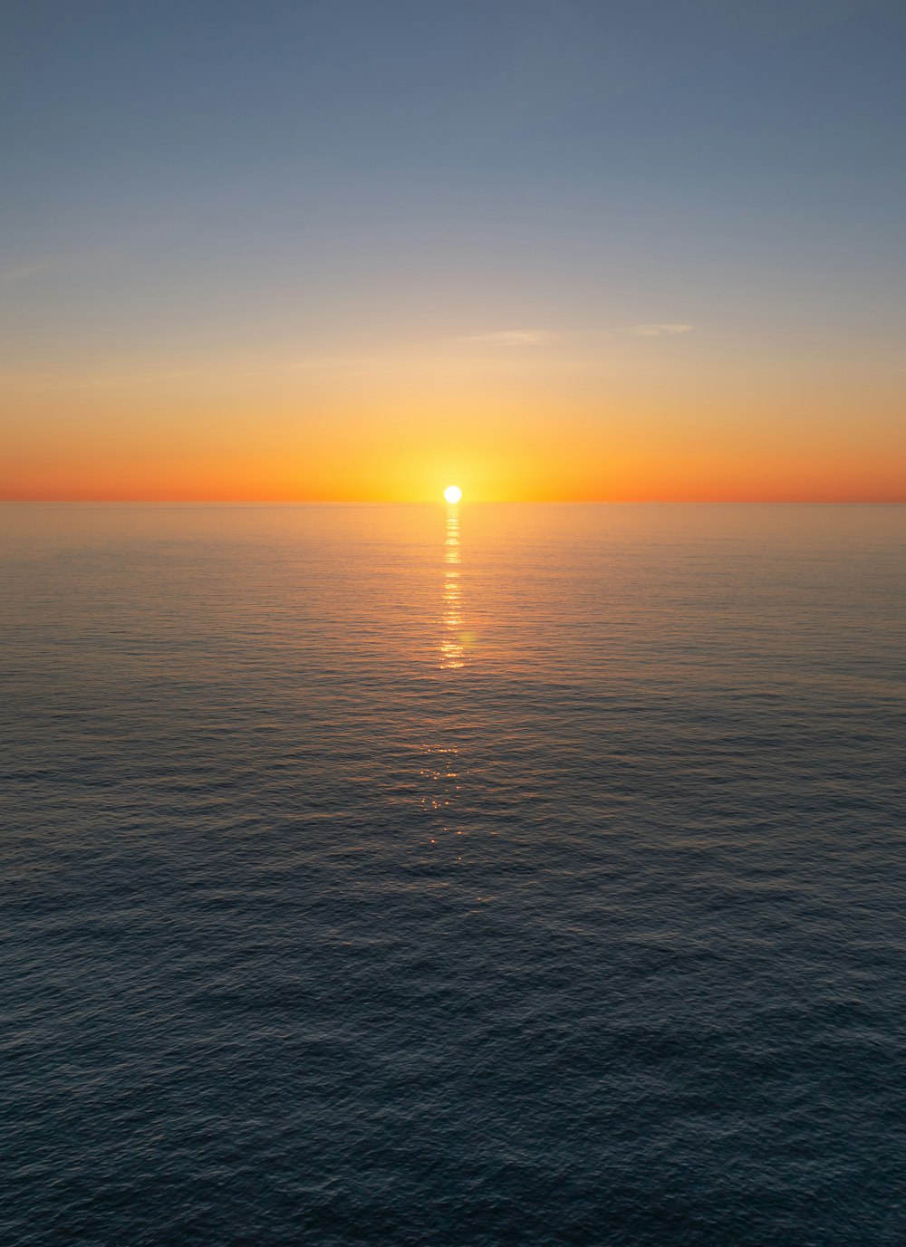 a sunset over a body of water