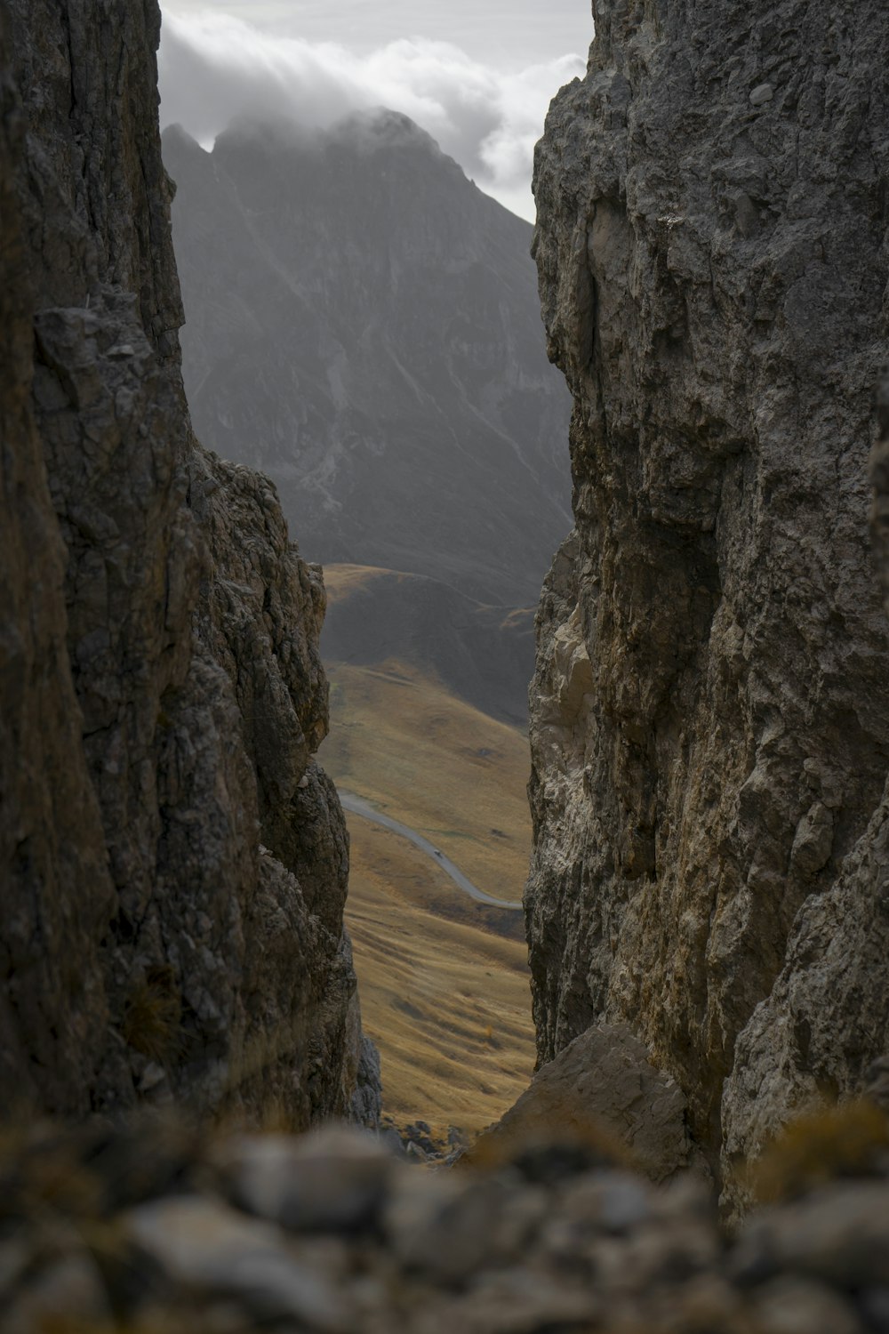 a view of a valley between two large rocks