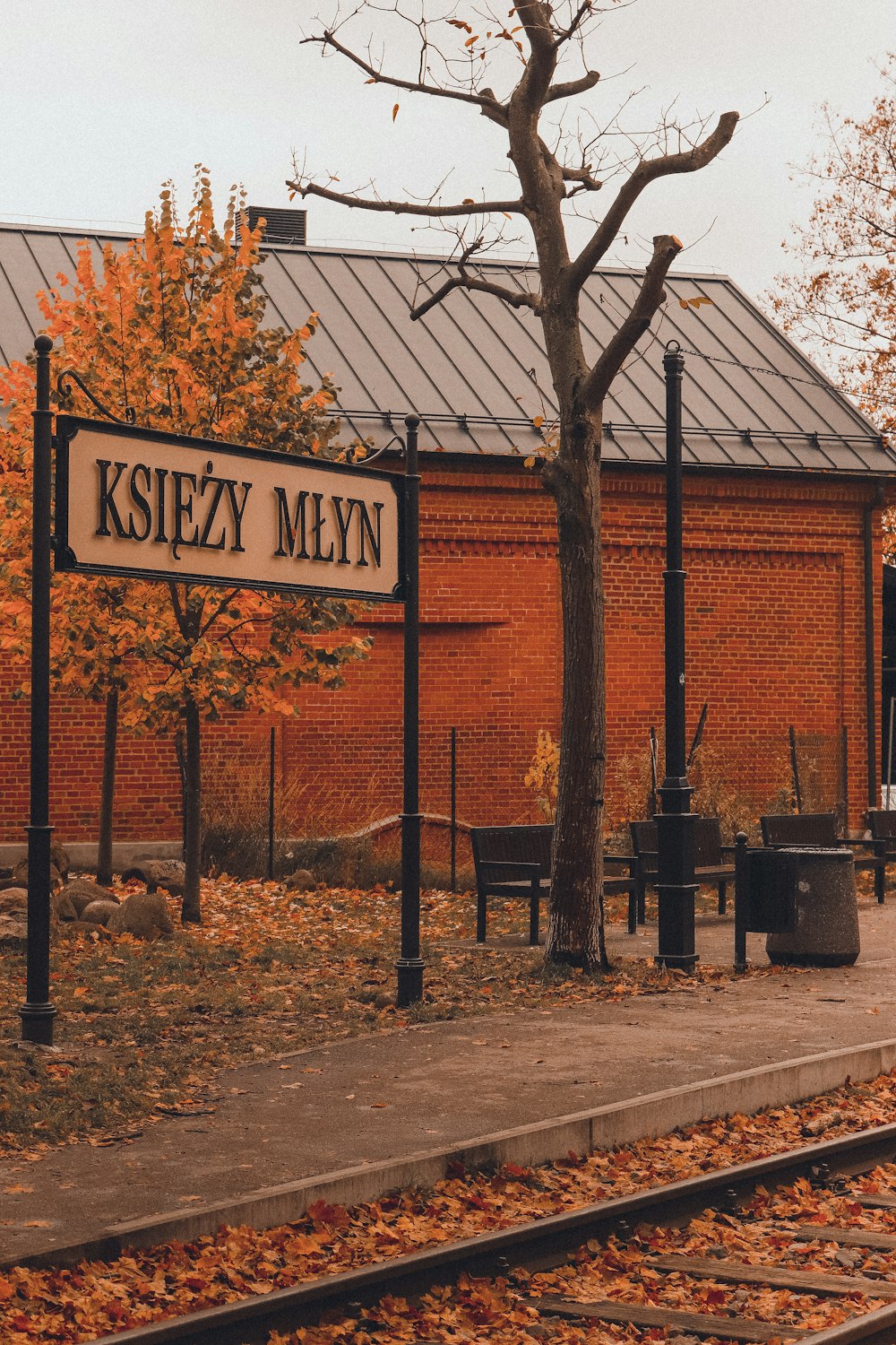 a sign in front of a brick building