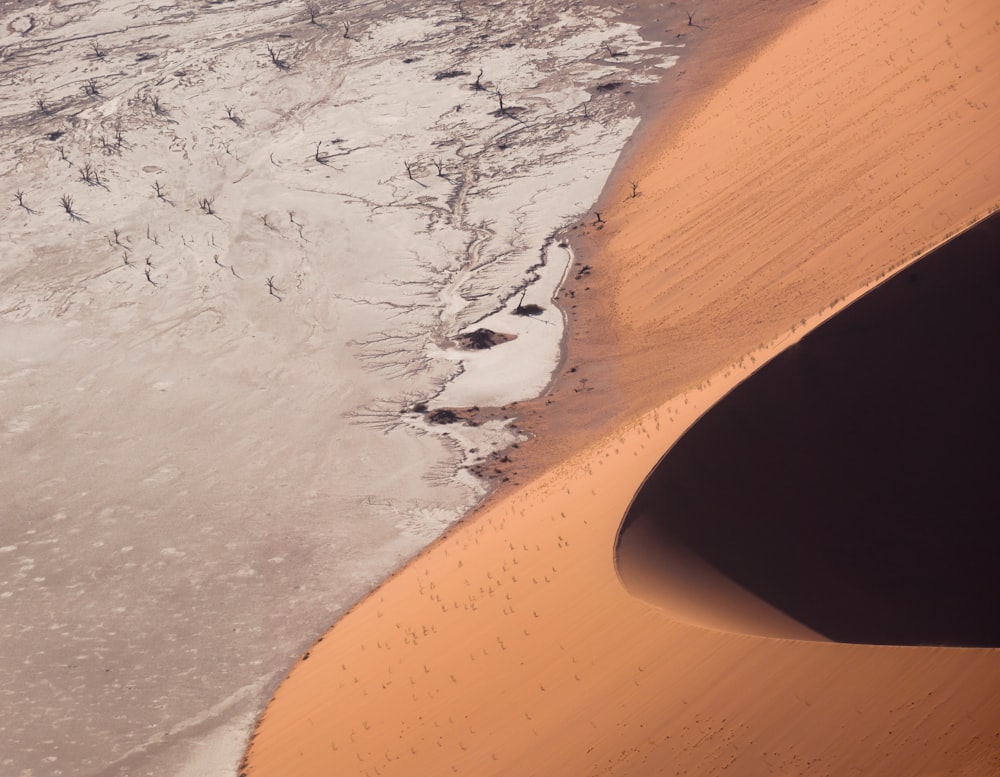 a sandy beach with a hole in it