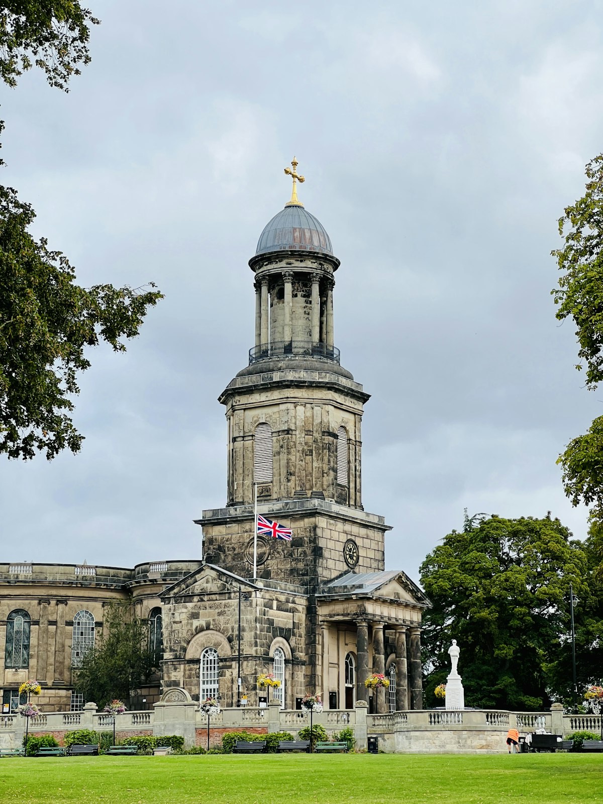 Historic building with a gilded statue in Shrewsbury, Shropshire