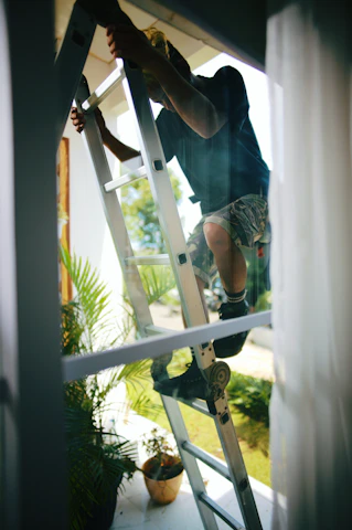 a person climbing a ladder