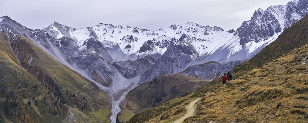 a group of people hiking in the mountains