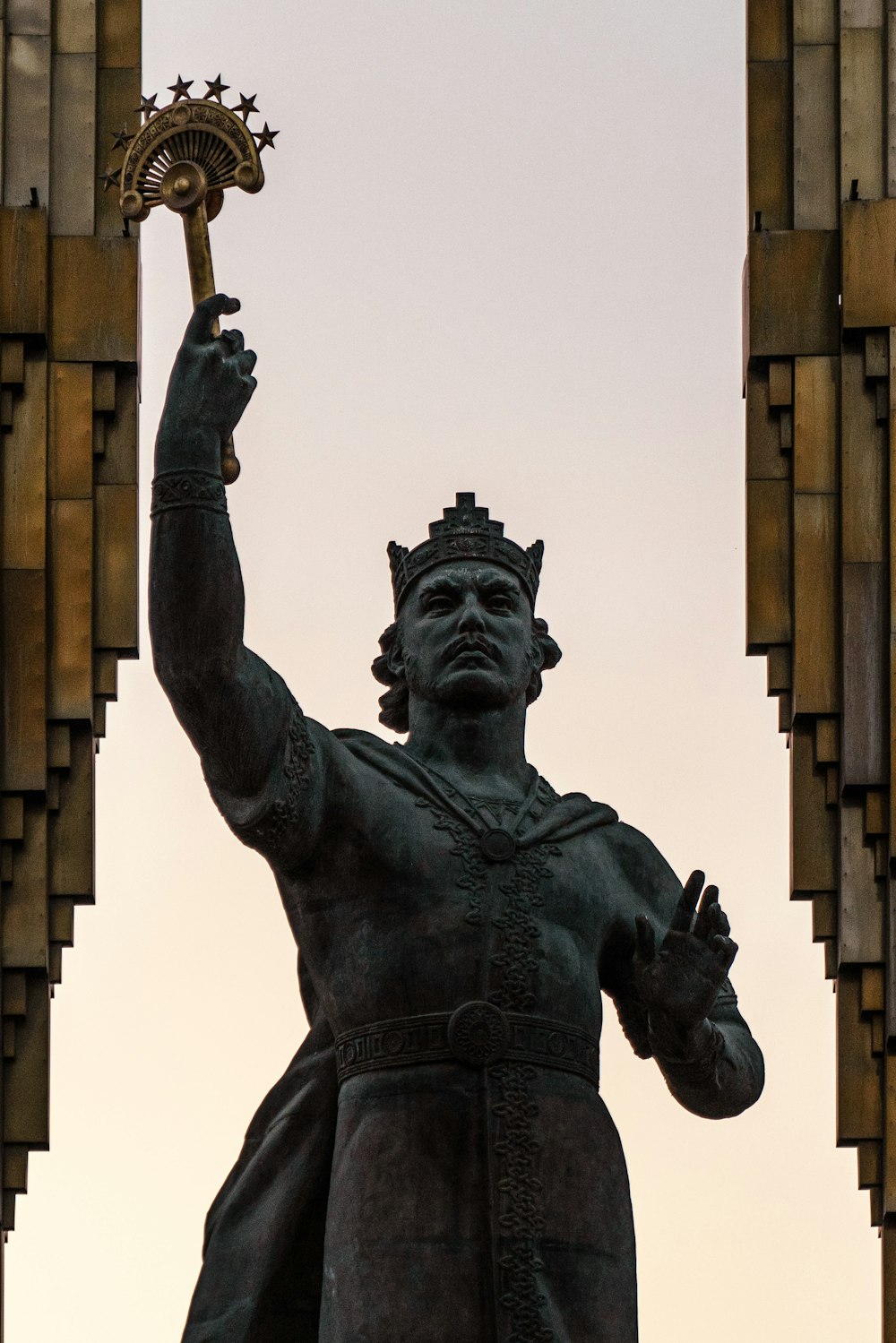 a statue of a person holding a torch