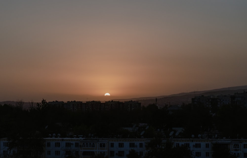 a city with a sunset in the background