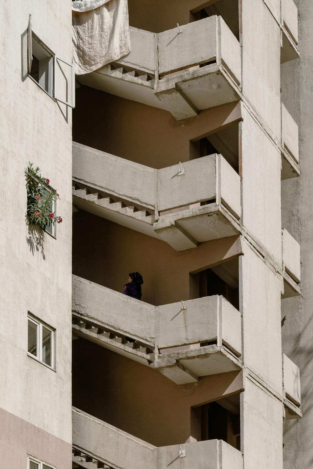 a person sitting on a balcony