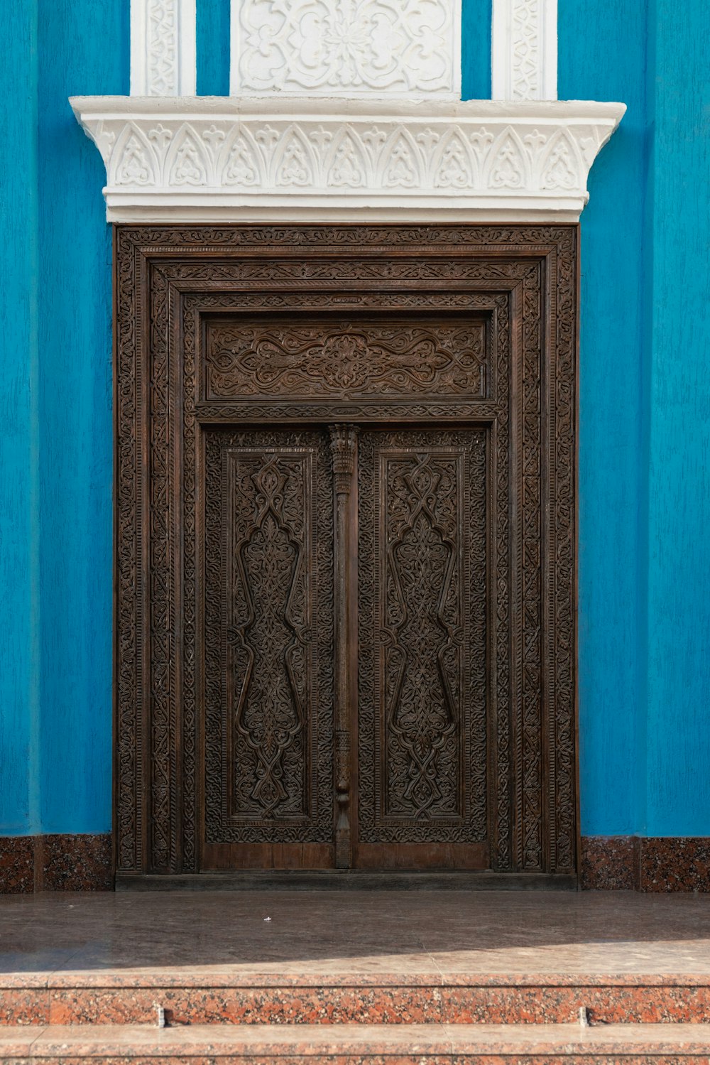 a wood door with a design on it