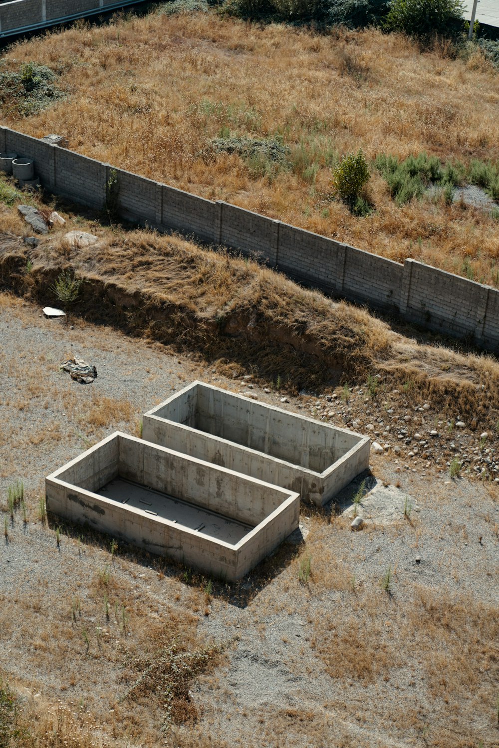 a concrete foundation with a fence