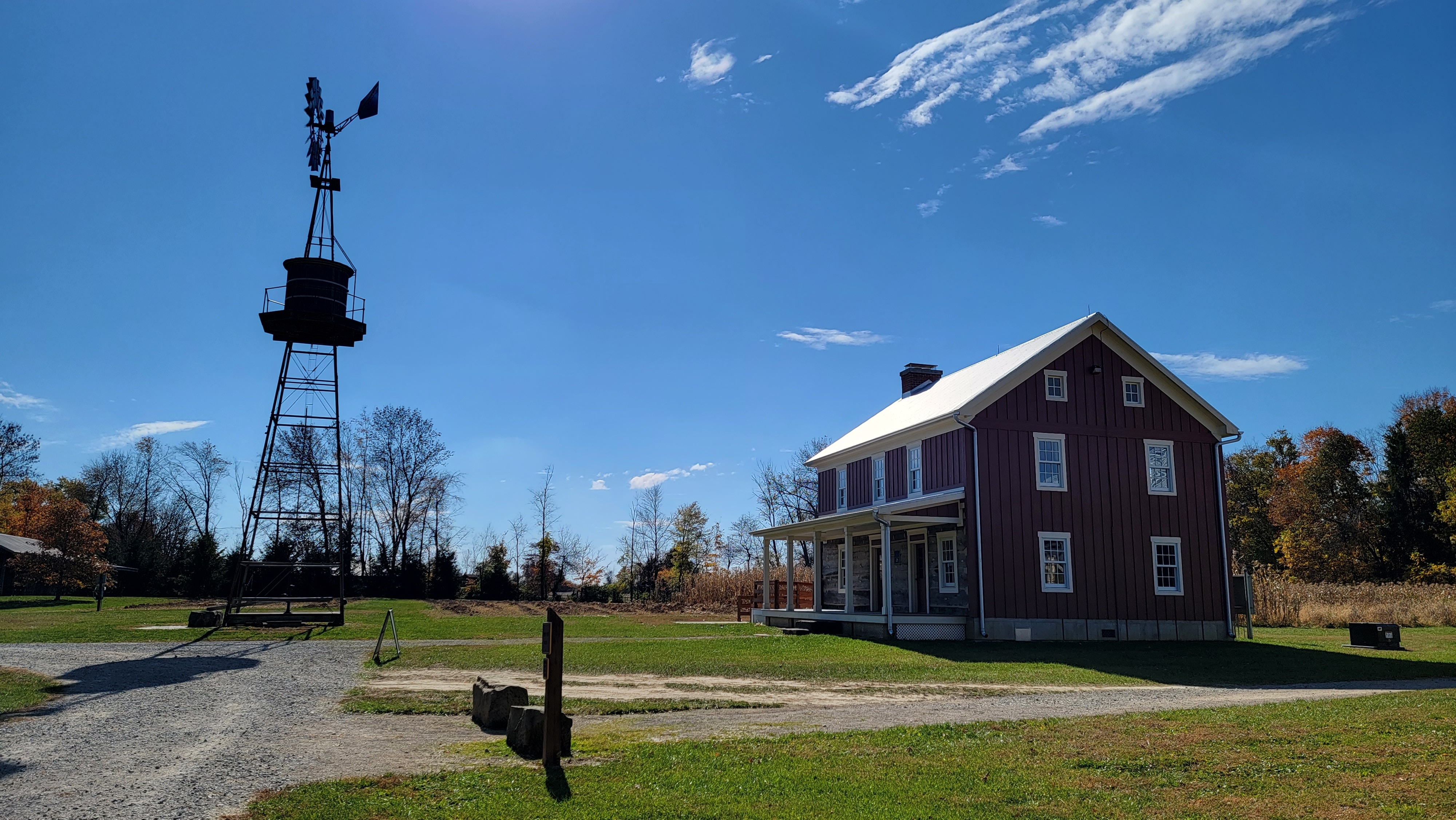 a red house with a windmill