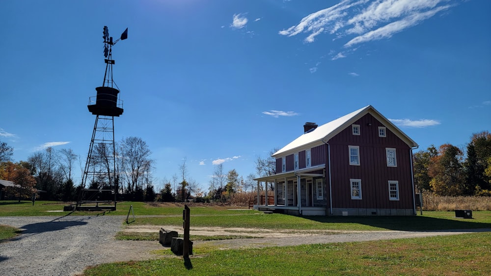 a red house with a windmill