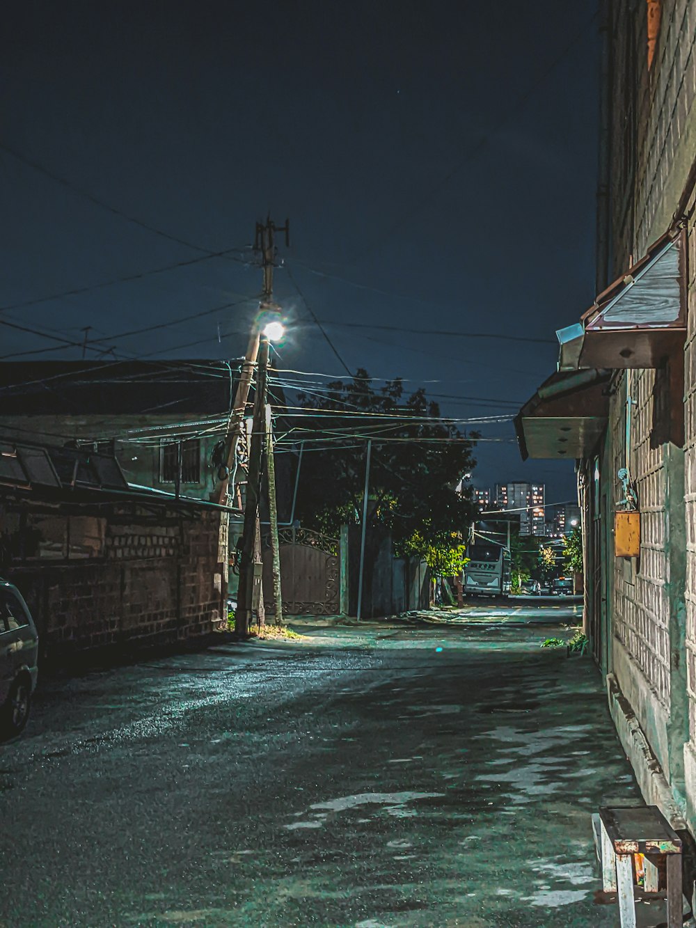 a street with buildings and wires