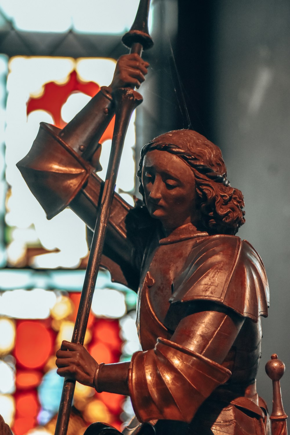 a statue of a person holding a flag