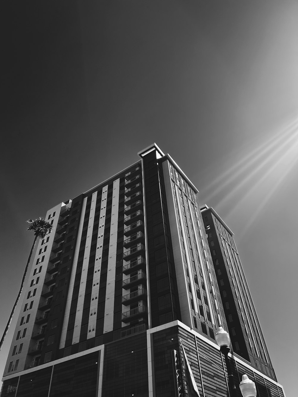 a tall building with a cloudy sky