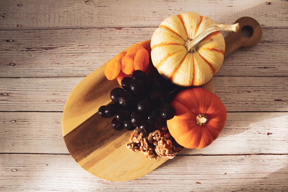 a group of fruits on a cutting board