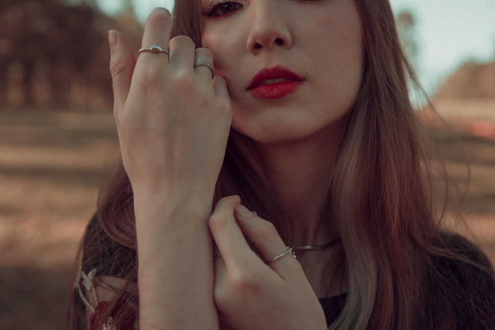 a woman holding her hand up