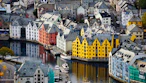 a city with many buildings and boats