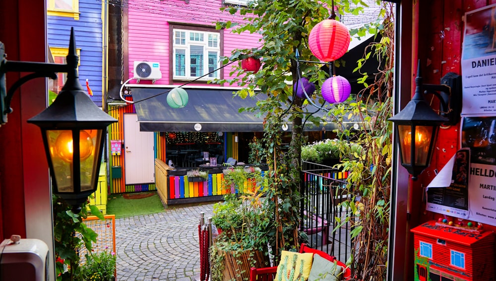 a colorful building with a brick walkway