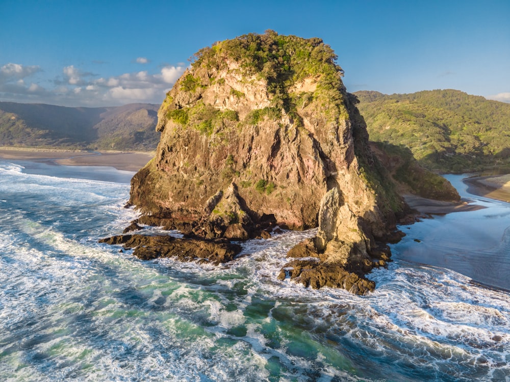 a large rock in the ocean