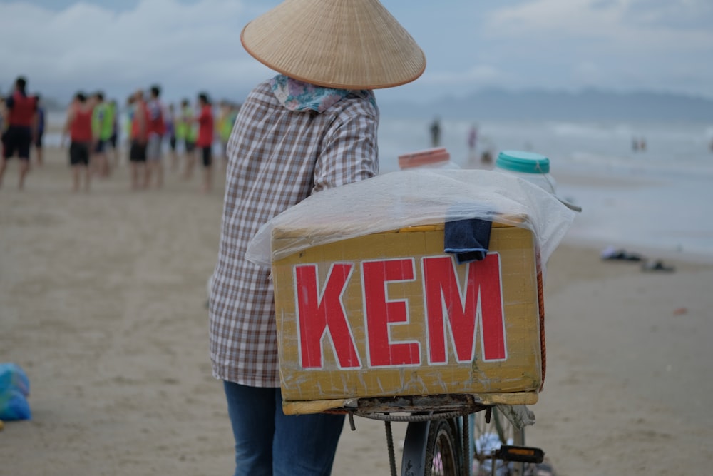 a person pushing a cart with a sign on it