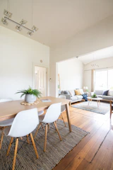 a dining room with a table and chairs
