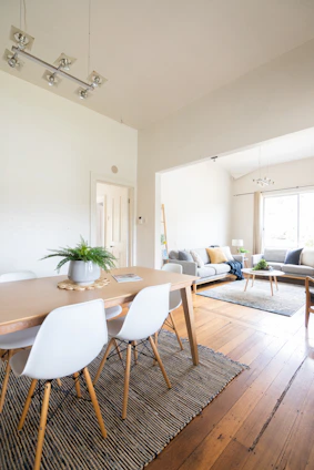 a dining room with a table and chairs