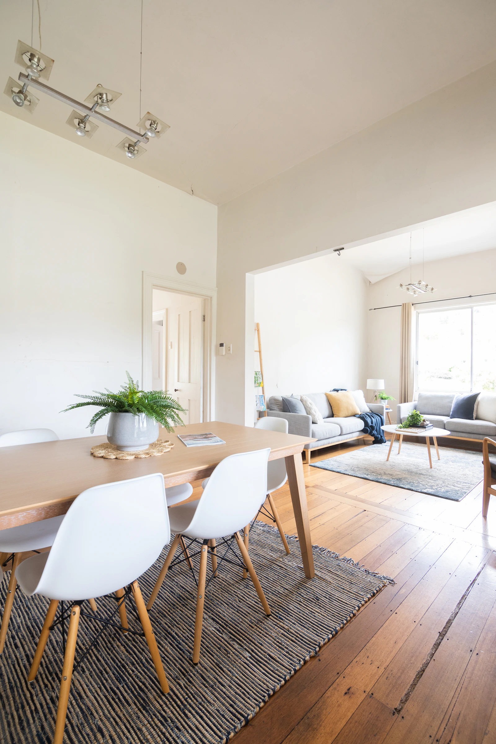 A dining room with a table and chairs