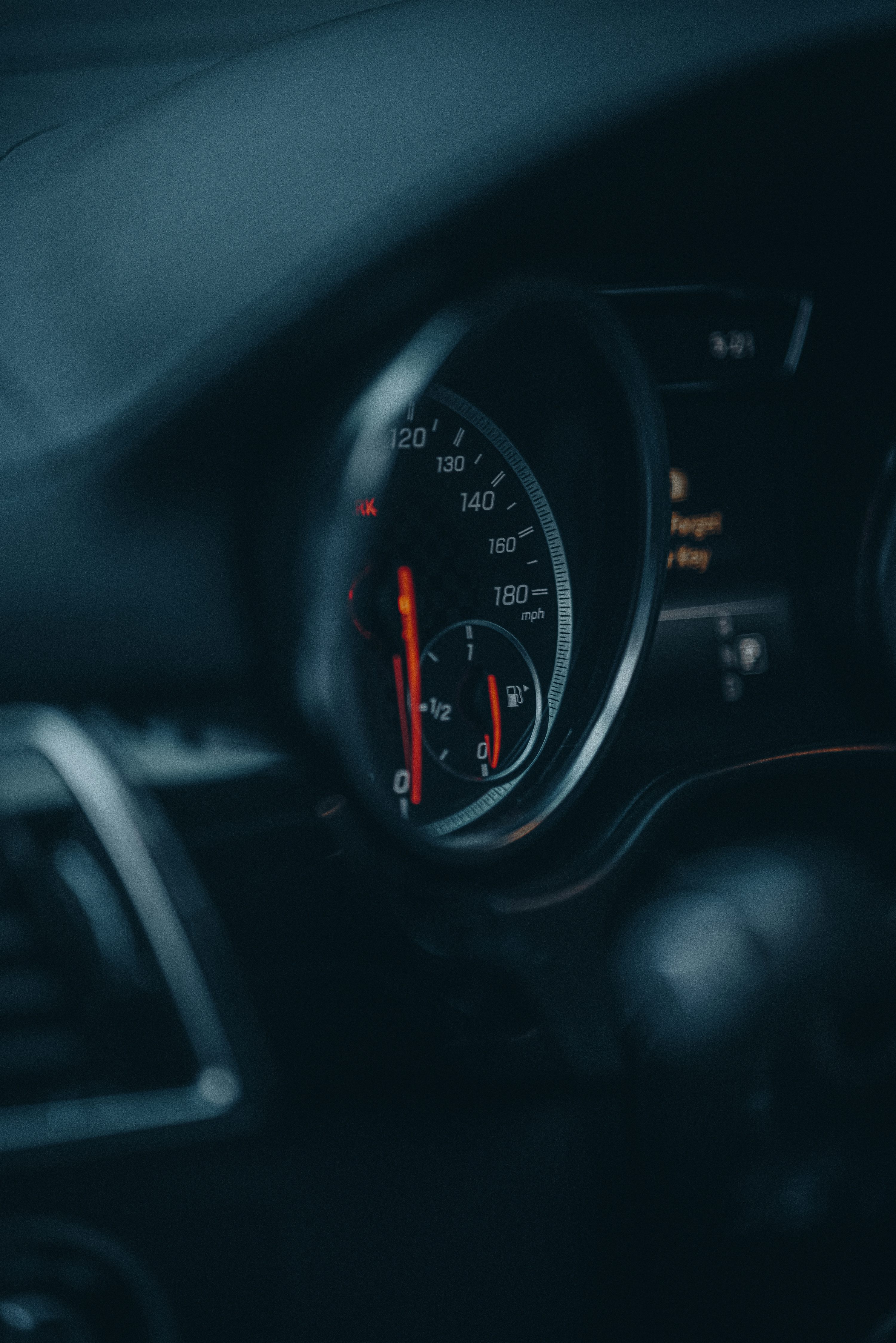 a car dashboard with a speedometer
