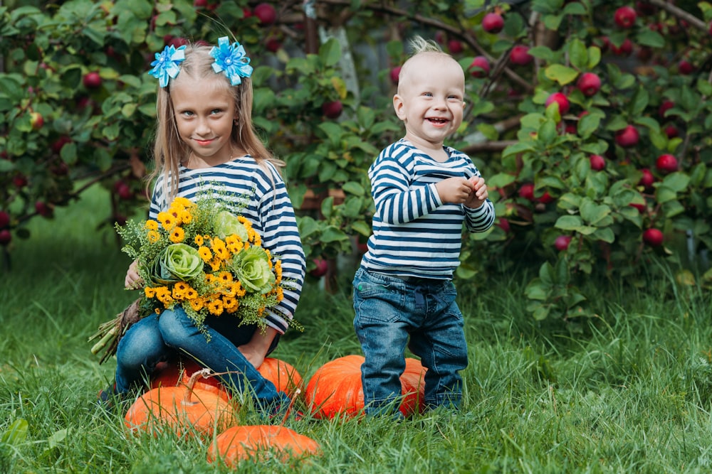 a boy and girl in a garden