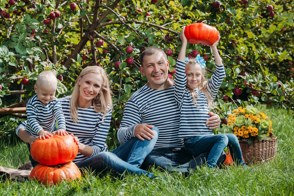 a family sitting on a bench