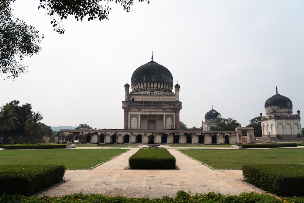 a large white building with domed roofs