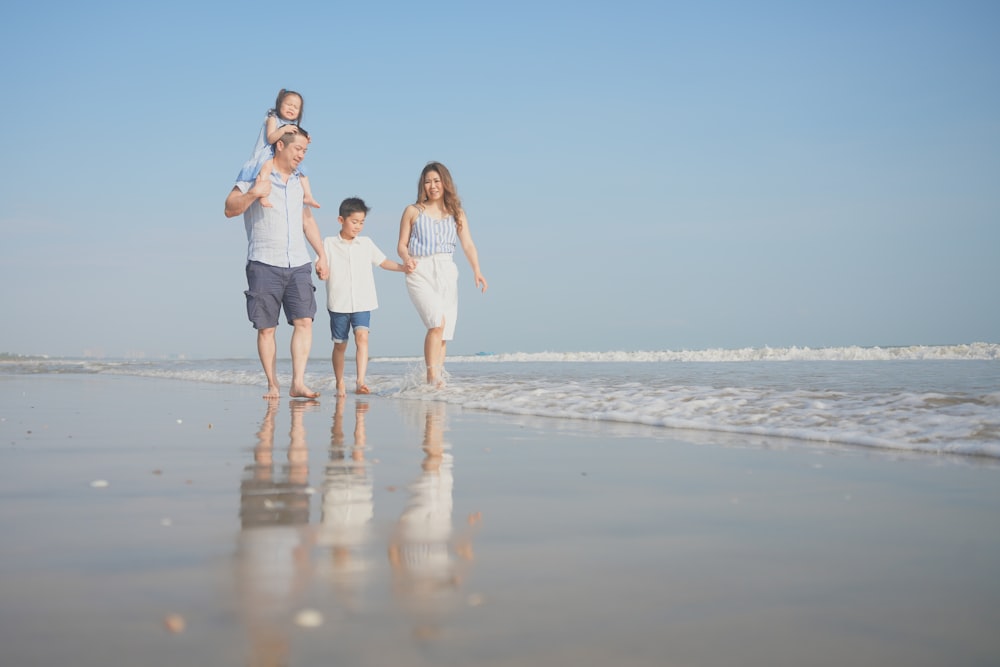 a family walking on the beach