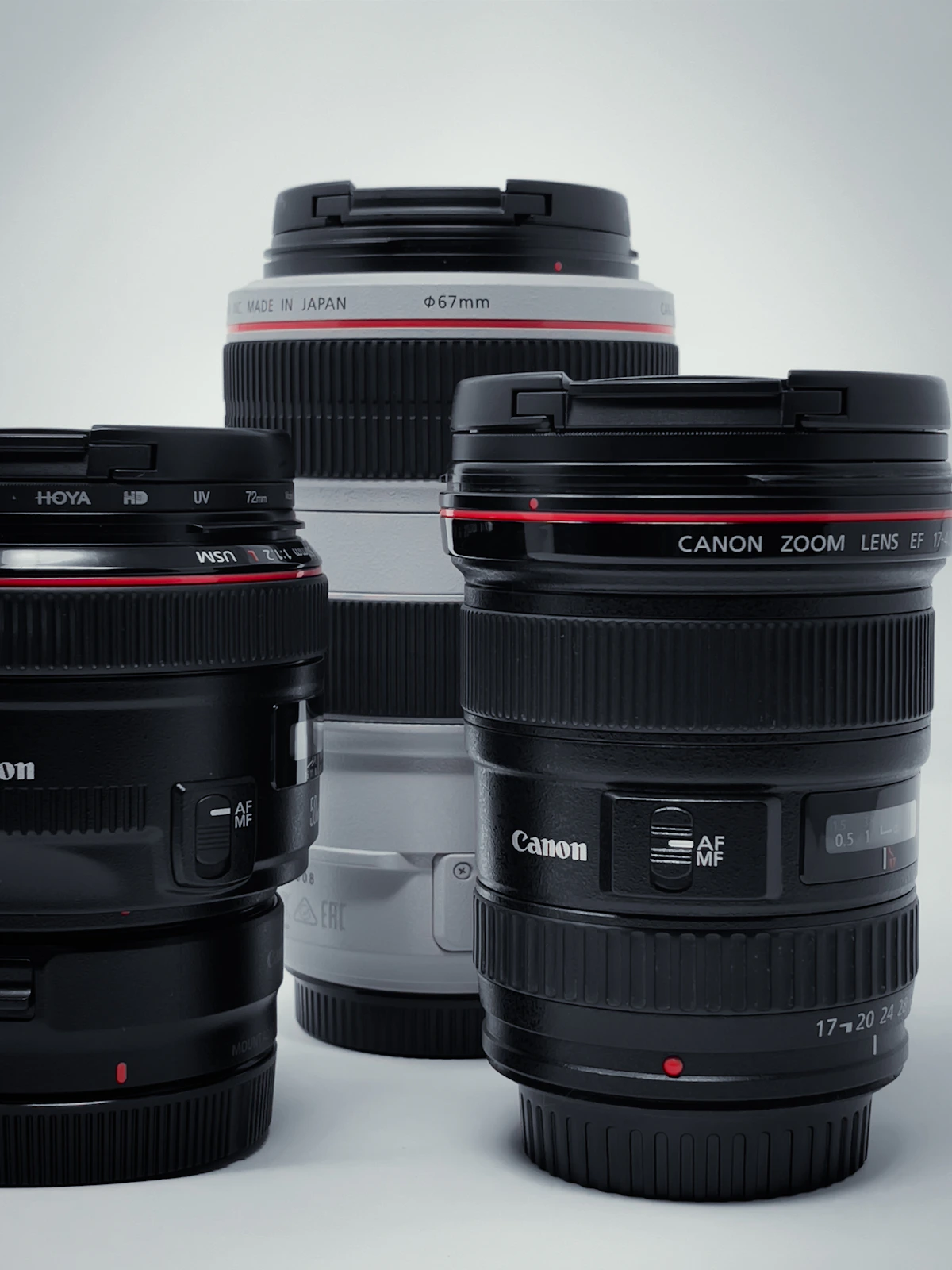 Professional camera lenses arranged for optical accessory workflow