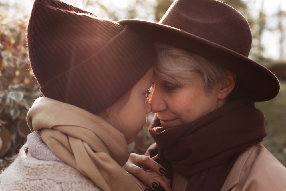 a woman kissing a man