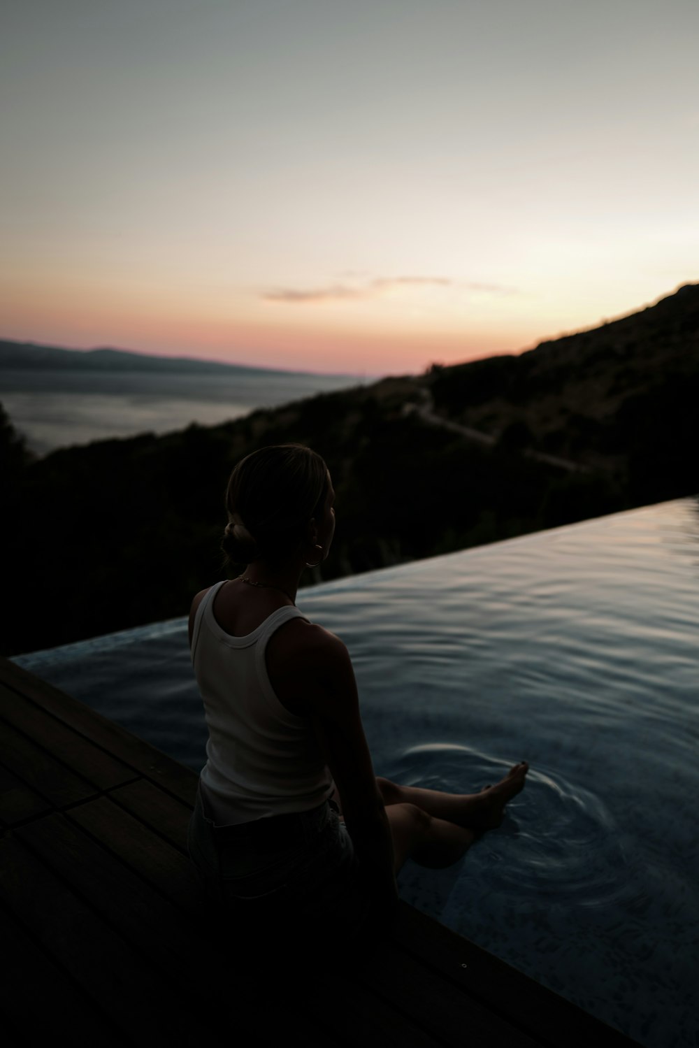 a man sitting on a dock