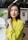 a woman with a yellow shirt