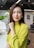 a woman with a yellow shirt