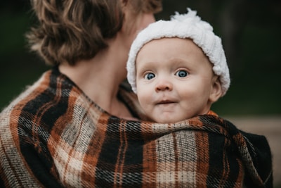 a person holding a baby