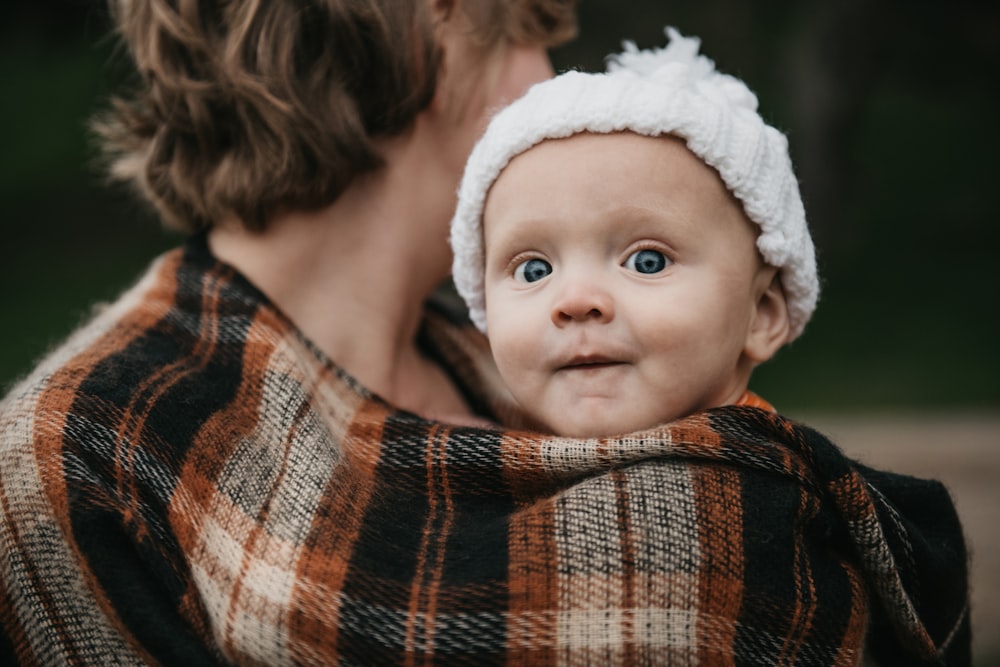 a person holding a baby