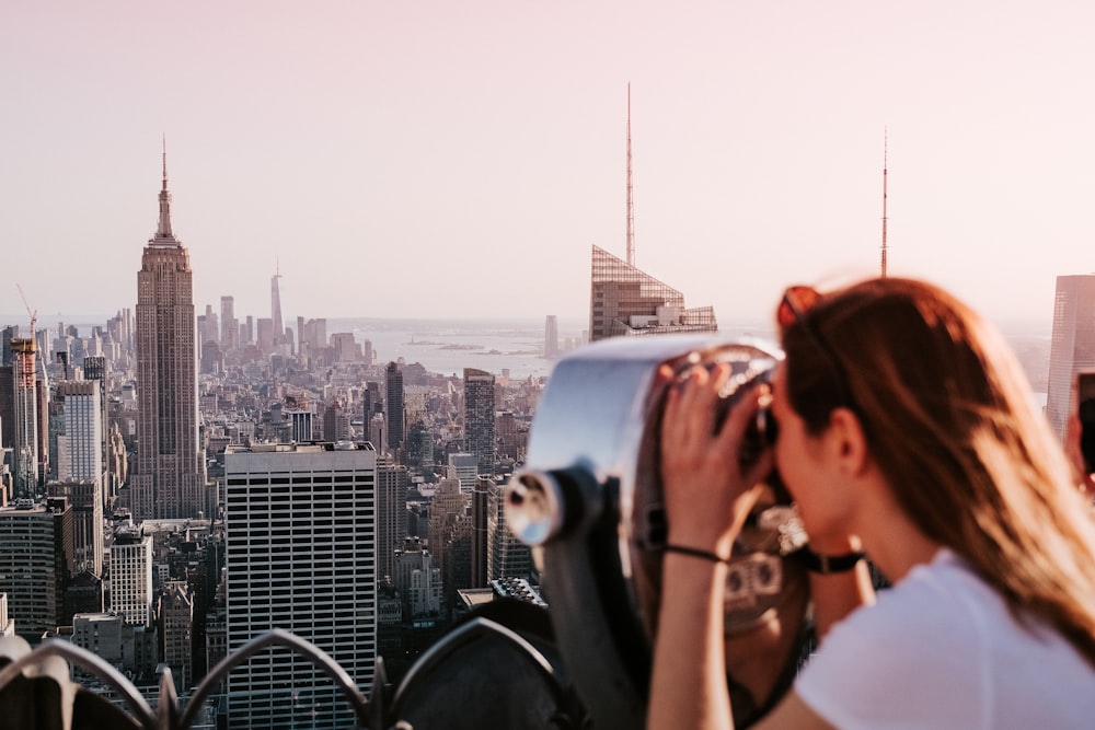 a person looking out a window at 30 Rockefeller Plaza