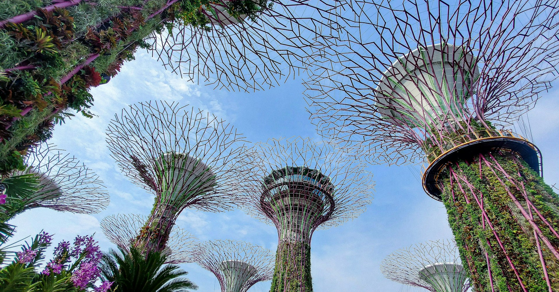 a tall tower with flowers around it