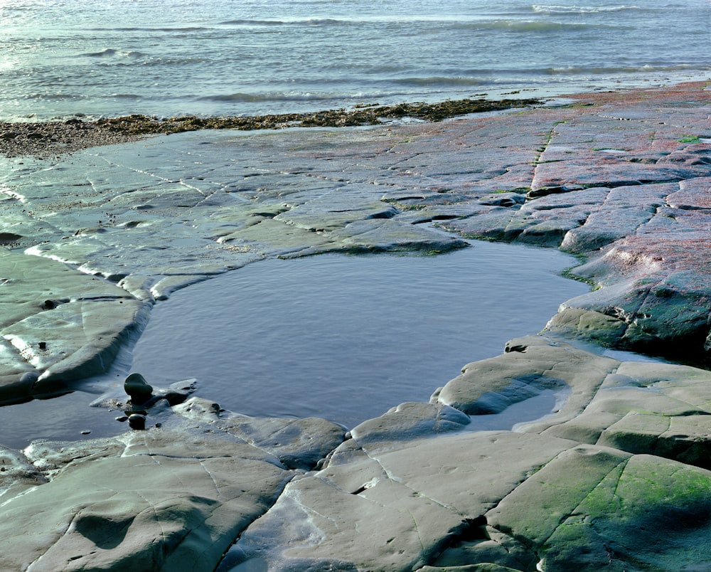 a rocky beach with snow