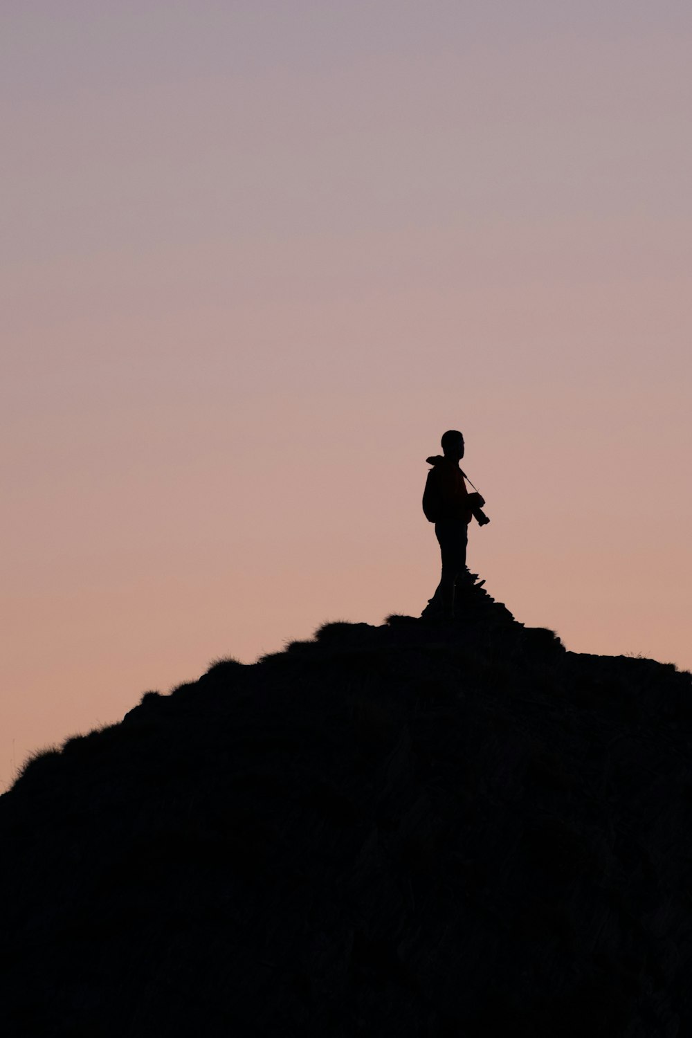 a person standing on a rock