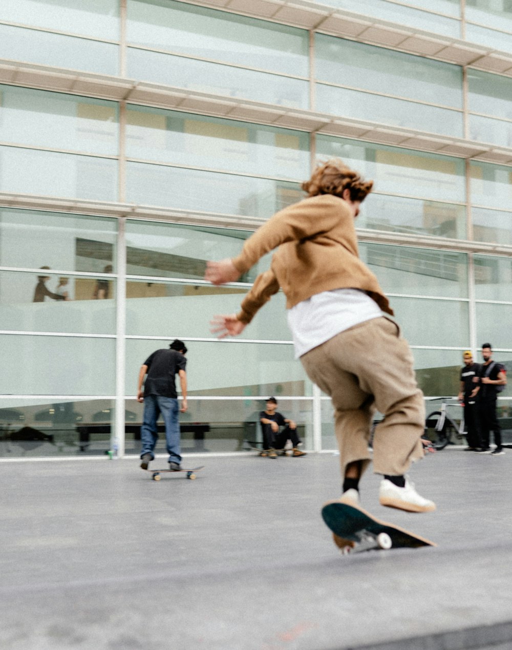 a man skating on the pavement